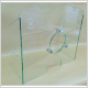 Photo d'une paroi de protection en verre avec hygiaphone circulaire et passe-documents